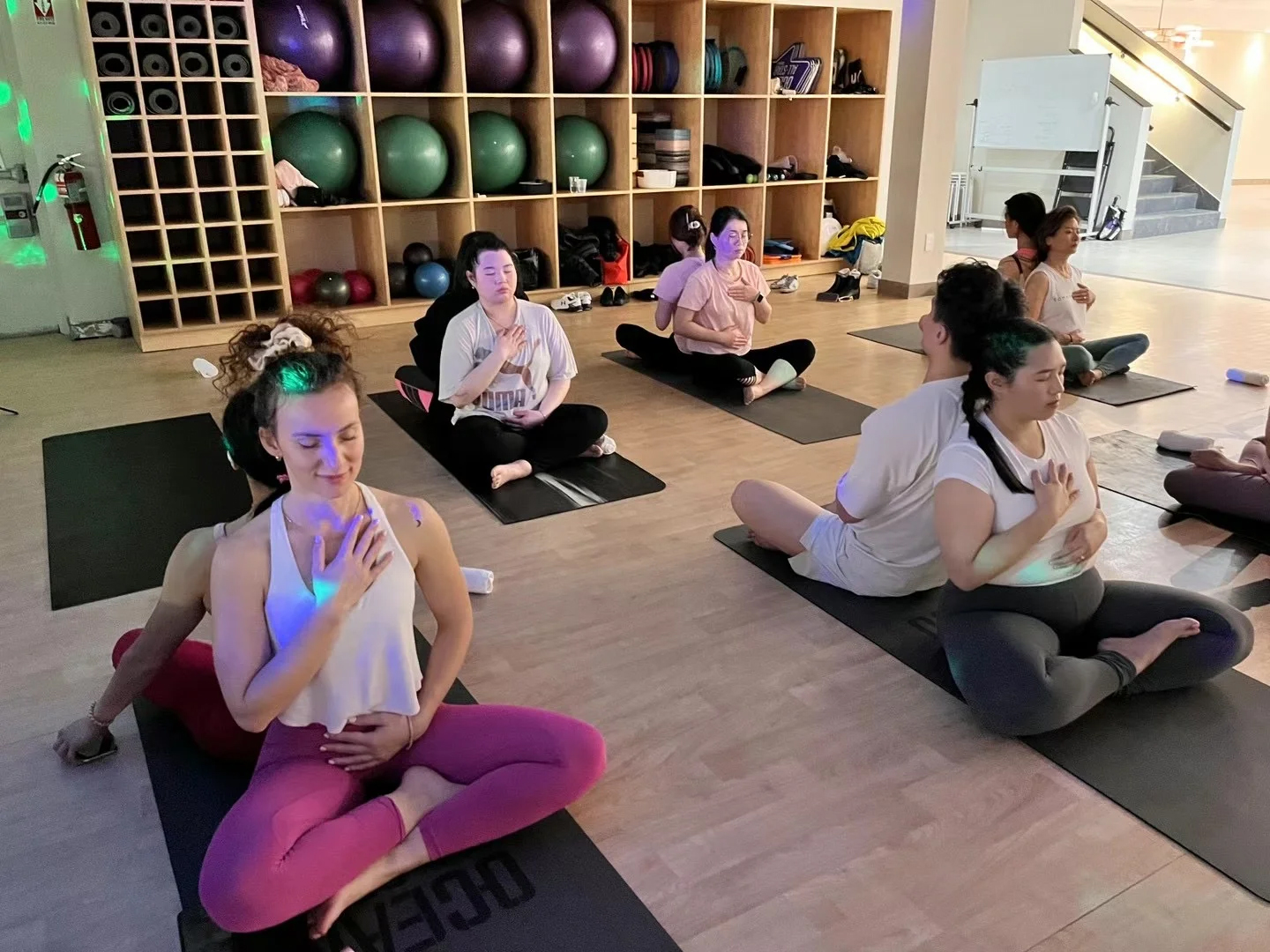 Yoga trainer guiding participants to feel inner strength and calm – women entrepreneurs health session